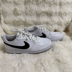 Nike White Low-Top Sneakers with Black Swoosh
